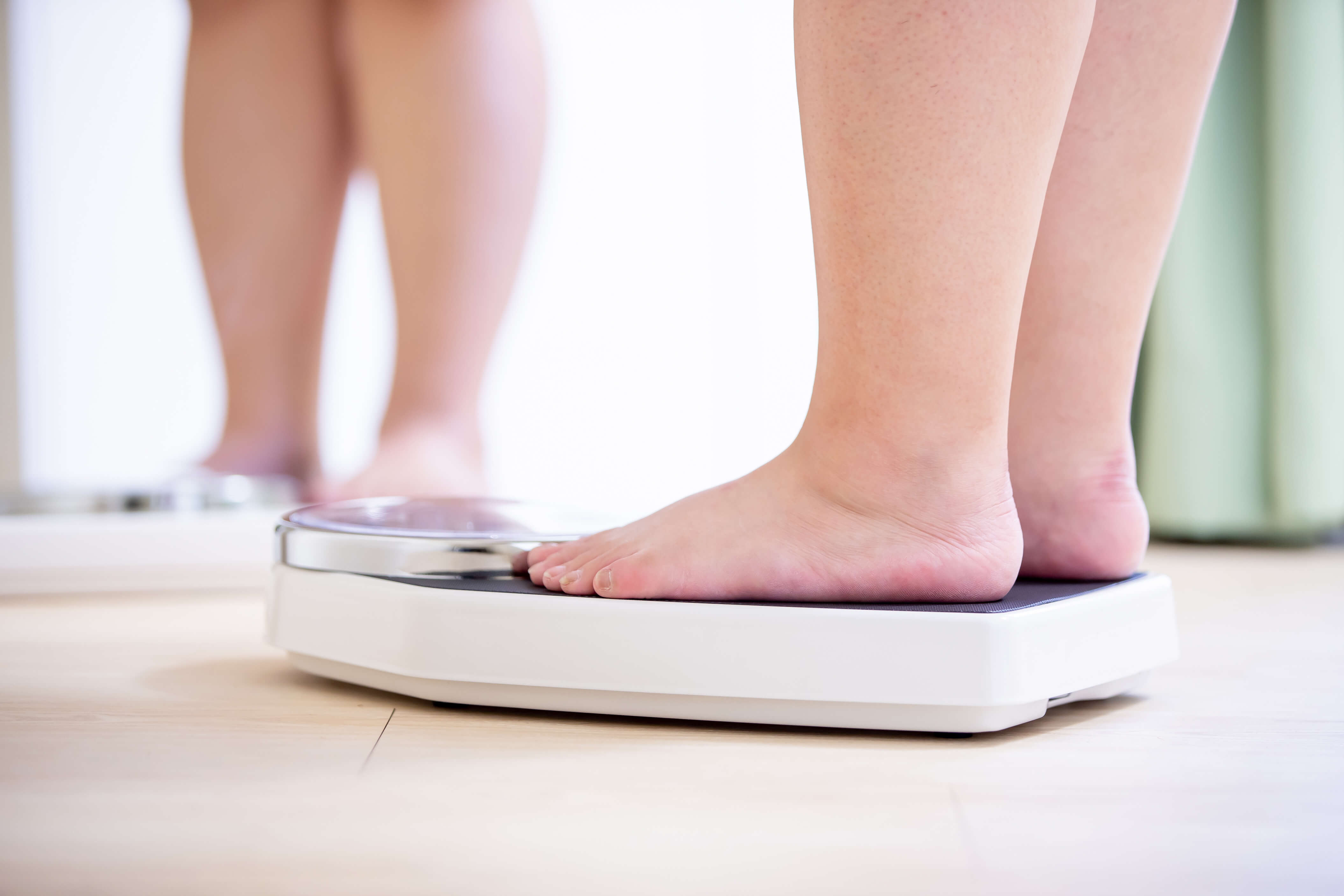 A person standing on a scale
