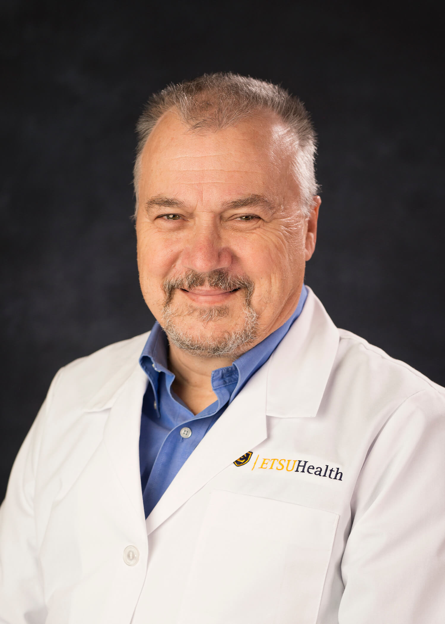 Portrait of Martin E. Olsen, M.D. – M.A.T.