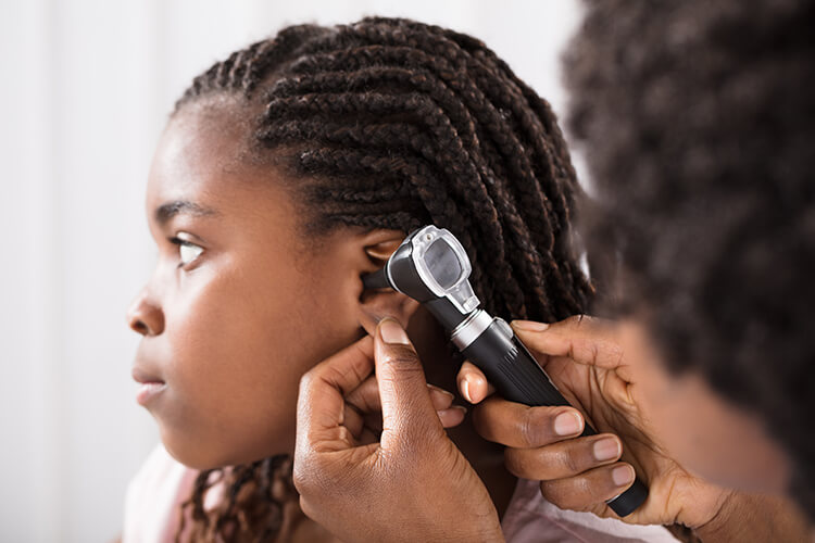 provider examining child's ear canal